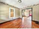 Living room with hardwood floors, a window, and view into other rooms at 3042 Newton Ave, Indianapolis, IN 46201