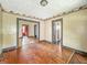 Living room with hardwood floors and a view into other rooms at 3042 Newton Ave, Indianapolis, IN 46201