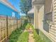 Narrow side yard with chain link fence between neighboring houses at 3042 Newton Ave, Indianapolis, IN 46201