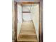 Stairway with white, textured walls and wooden steps provides access to upper or lower levels at 3042 Newton Ave, Indianapolis, IN 46201