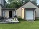Backyard with deck, grill, green lawn, and attached garage at 3143 Carson Ave, Indianapolis, IN 46227
