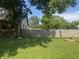 The large, green backyard features a privacy fence and mature shade trees at 3143 Carson Ave, Indianapolis, IN 46227