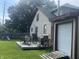 Spacious backyard with a deck, grill, green lawn, and shed at 3143 Carson Ave, Indianapolis, IN 46227