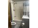 Cozy bathroom featuring a shower-tub combo, toilet, sink, and neutral decor at 3143 Carson Ave, Indianapolis, IN 46227