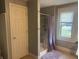 Bathroom featuring a shower stall with a tile surround and a privacy curtain at 3143 Carson Ave, Indianapolis, IN 46227