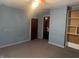 Bedroom with outdated blue walls and carpet, offering potential for personalization at 3143 Carson Ave, Indianapolis, IN 46227