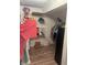 Walk-in closet with wire shelving providing ample storage, complemented by wood-look floors at 3143 Carson Ave, Indianapolis, IN 46227