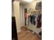 Organized closet with hanging clothes and shelves, showcasing efficient storage solutions at 3143 Carson Ave, Indianapolis, IN 46227