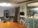 This dining room has hardwood floors, a vintage furniture, and neutral decor at 3143 Carson Ave, Indianapolis, IN 46227