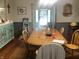 Traditional dining room with gray paint, wood floors and decorative furnishings at 3143 Carson Ave, Indianapolis, IN 46227