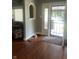 Entryway featuring hardwood floors, an arched niche, and a door with decorative ironwork at 3143 Carson Ave, Indianapolis, IN 46227