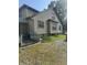 Side exterior of home with a walkway, neutral siding, and well-placed windows for natural light at 3143 Carson Ave, Indianapolis, IN 46227