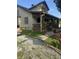 Inviting two-story home with brick accents, a cozy front porch, and a well-manicured lawn leading to the entrance at 3143 Carson Ave, Indianapolis, IN 46227