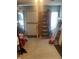 The garage features an exterior door, unfinished walls, and ample storage space at 3143 Carson Ave, Indianapolis, IN 46227