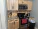 Stainless and black appliances with oak cabinets and laminate countertops in a kitchen at 3143 Carson Ave, Indianapolis, IN 46227