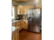 This kitchen features granite countertops, stainless steel appliances, and wooden cabinetry at 3143 Carson Ave, Indianapolis, IN 46227