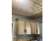 Oak cabinets and wood paneled ceiling in a kitchen at 3143 Carson Ave, Indianapolis, IN 46227