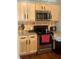 This kitchen features granite countertops, stainless steel appliances, and wooden cabinetry at 3143 Carson Ave, Indianapolis, IN 46227