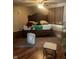 Bedroom with hardwood flooring, an area rug, and furniture at 3143 Carson Ave, Indianapolis, IN 46227
