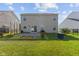 Backyard with a patio, lush lawn, and fenced perimeter at 3230 Hemlock St, Whiteland, IN 46184