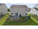 Aerial view of backyard featuring a patio and well-maintained lawn at 3230 Hemlock St, Whiteland, IN 46184