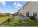 Backyard with a patio, flower beds, and lawn at 3230 Hemlock St, Whiteland, IN 46184