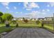 Backyard featuring a large stone patio and scenic water views at 3230 Hemlock St, Whiteland, IN 46184