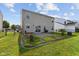 Backyard showcasing a patio, lawn, and a two-story house at 3230 Hemlock St, Whiteland, IN 46184