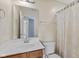 Bathroom with a single sink vanity and framed mirror at 3230 Hemlock St, Whiteland, IN 46184