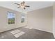 Inviting bedroom with natural light streaming through the windows and a modern ceiling fan at 3230 Hemlock St, Whiteland, IN 46184