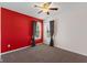 Bedroom featuring a ceiling fan, two windows, and gray carpet flooring at 3230 Hemlock St, Whiteland, IN 46184