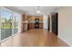 Bright, open kitchen with wood cabinets and modern appliances overlooking a sliding door to the back yard at 3230 Hemlock St, Whiteland, IN 46184