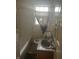 Bathroom with a bathtub, toilet, and sink with a tiled countertop at 3429 Kinnear Ave, Indianapolis, IN 46218