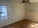 Bedroom featuring hardwood flooring and window overlooking the exterior at 3429 Kinnear Ave, Indianapolis, IN 46218