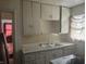 Classic kitchen featuring cabinetry, countertop space, and a sink at 3429 Kinnear Ave, Indianapolis, IN 46218