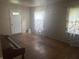 Bright living room features hardwood floors and lots of natural light at 3429 Kinnear Ave, Indianapolis, IN 46218