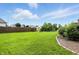 A large backyard and pond are featured in this home at 35 Decourcy Ln, Franklin, IN 46131