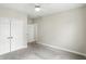 Bedroom with carpet flooring, neutral paint, ceiling fan, and double door closet at 35 Decourcy Ln, Franklin, IN 46131