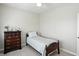 Cozy bedroom featuring neutral paint, a single bed, dresser, and ceiling fan at 35 Decourcy Ln, Franklin, IN 46131