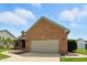 Spacious two-car garage with brick facade and ample parking in a well-kept neighborhood at 35 Decourcy Ln, Franklin, IN 46131