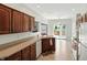 Spacious kitchen offers sliding door to the deck, tile floor, and ample counter space at 35 Decourcy Ln, Franklin, IN 46131