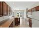 Well-lit kitchen with sliding door to the patio, tile floor, and plenty of cabinet space at 35 Decourcy Ln, Franklin, IN 46131