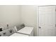 Functional laundry room with a white washer and dryer, and a white door at 35 Decourcy Ln, Franklin, IN 46131
