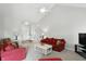 Bright living room features vaulted ceilings, plush seating, and neutral carpeting at 35 Decourcy Ln, Franklin, IN 46131