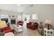 Spacious living room with vaulted ceilings, fireplace, and sliding doors to deck at 35 Decourcy Ln, Franklin, IN 46131