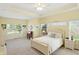 Spacious main bedroom with tray ceiling, carpet flooring, and large windows with ample natural light at 35 Decourcy Ln, Franklin, IN 46131