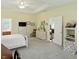 Spacious main bedroom with tray ceiling, carpet flooring, and plenty of storage space at 35 Decourcy Ln, Franklin, IN 46131