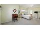 Bright main bedroom with carpet flooring, a desk, and large windows with ample natural light at 35 Decourcy Ln, Franklin, IN 46131