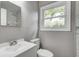 Bright bathroom with a sink and a window at 3617 Woodcliff Dr, Indianapolis, IN 46203