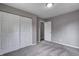 Bedroom with carpet and closet with sliding doors at 3617 Woodcliff Dr, Indianapolis, IN 46203